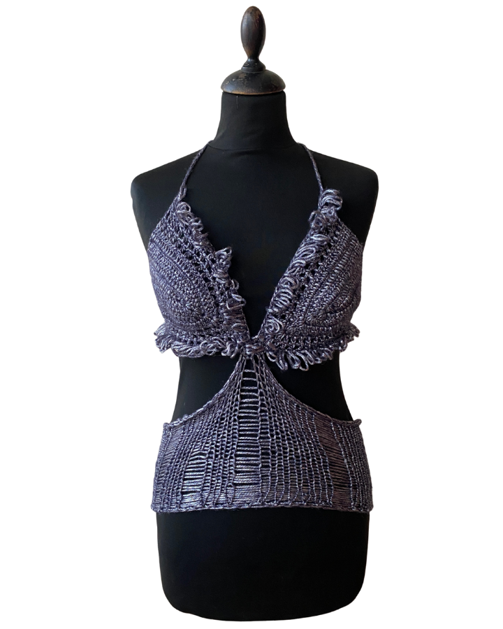 Black mannequin wearing a textured black and gray top on a white background